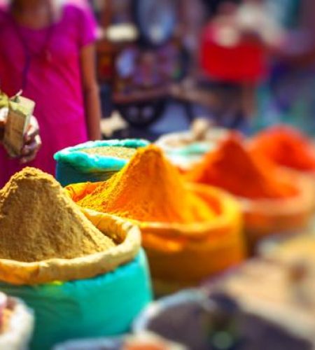 Colorful spices powders and herbs in traditional street market in delhi. india.